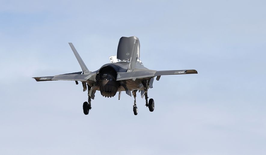 An F-35B fighter jet, the U.S. Marine Corps variant of the F-35 from the Marine Corps Air Station in Yuma, Ariz., flies into Luke Air Force Base in Goodyear, Ariz., on Dec. 10, 2013. (Associated Press) ** FILE **