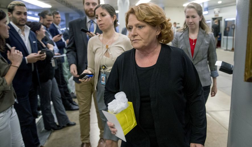 In this Sept. 25, 2018 file photo, Sen. Heidi Heitkamp, D-N.D., walks through the Senate Subway as she arrive at the Capitol, in Washington. Heitkamp suggested Friday, Sept. 28 she may vote no on Brett Kavanaugh&#x27;s confirmation to the Supreme Court, saying &quot;There are a lot of lawyers in America who can sit on the court&quot; and Kavanaugh isn&#x27;t the only person who can do the job.&quot; (AP Photo/Andrew Harnik, File)