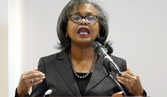 FILE - In this Sept. 26, 2018 file photo, Anita Hill speaks at the University of Utah in Salt Lake City.  Hill says one of the things that stood out to her from Supreme Court nominee Brett Kavanaugh&#39;s hearing was how his emotional and angry testimony compared to the calm testimony of the woman accusing him of sexual assault. Hill gave Senate testimony in 1991 about her allegations of sexual harassment by then-Supreme Court nominee Clarence Thomas. Hill spoke on Friday, Sept. 28, in Houston at a gathering of women technologists, one day after Kavanaugh and Christine Blasey Ford testified before the Senate Judiciary Committee. (AP Photo/Rick Bowmer, File)