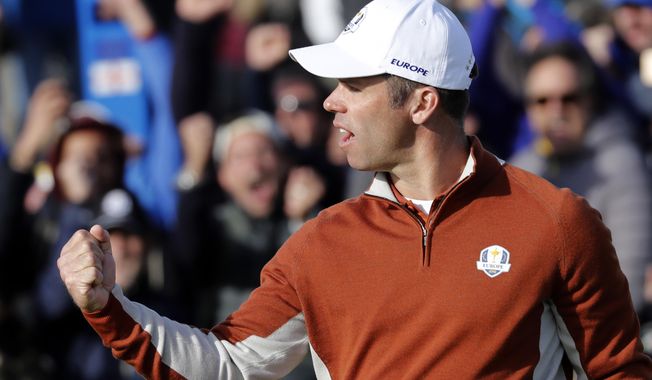 Europe's Paul Casey reacts after making a birdie put during his fourball match on the opening day of the 2018 Ryder Cup at Le Golf National in Saint Quentin-en-Yvelines, outside Paris, France, Saturday, Sept. 29, 2018. (AP Photo/Laurent Cipriani)