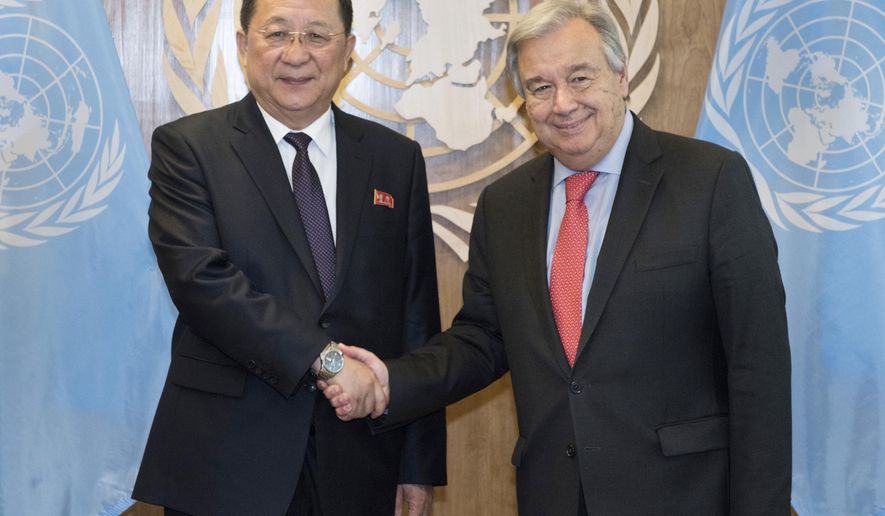 In this photo provided by the United Nations, Ri Yong Ho, left, Minister for Foreign Affairs, Democratic People's Republic of Korea, is greeted by United Nations Secretary General Antonio Guterres during the United Nations General Assembly, Friday, Sept. 28, 2018 at U.N. Headquarters. (Kim Haughton/The United Nations via AP )