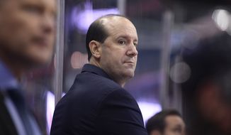 Washington Capitals head coach Todd Reirden watches from the bench during the third period of an NHL preseason hockey game against the St. Louis Blues, Sunday, Sept. 30, 2018, in Washington. The Capitals won 5-2. (AP Photo/Nick Wass) ** FILE **