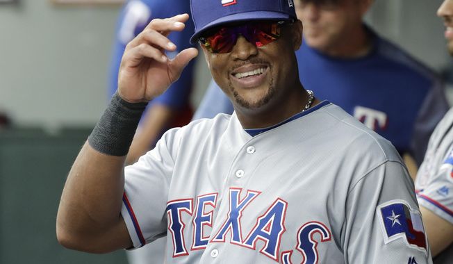 Texas Rangers&#x27; Adrian Beltre smiles in the dugout during the fifth inning of a baseball game against the Seattle Mariners after he was replaced by Jurickson Profar at third base, Sunday, Sept. 30, 2018, in Seattle. (AP Photo/Ted S. Warren)