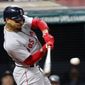 File-This Sept. 23, 2018, file photo shows Boston Red Sox&#39;s Mookie Betts hitting a double in the seventh inning of a baseball game against the Cleveland Indians, in Cleveland.  Betts won this year’s AL batting title at .346 and with (32) homers and 30 (stolen bases) became the first player to lead either league in batting as part of a 30-30 season.  (AP Photo/Tom E. Puskar, File)