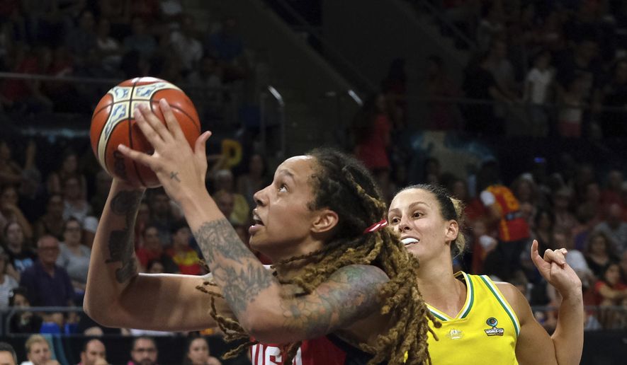 Brittney Griner of the United States, left, jumps to shoot as Steph Talbot of Australia tries to stop her during the Women&#39;s basketball World Cup final match between Australia and the U.S.A. in Tenerife, Spain, Sunday Sept. 30, 2018. (AP Photo/Andres Gutierrez)