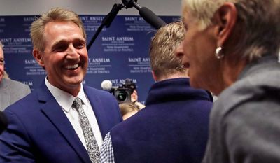 U.S. Sen. Jeff Flake, R-Arizona, shakes hands with a guest following an address in Manchester, N.H., Monday, Oct. 1, 2018. Flake, days after a critical vote in support of Supreme Court nominee Brett Kavanaugh, made his second visit this year to New Hampshire. The visit will once again stoke suggestions that he might run against President Trump in 2020. (AP Photo/Charles Krupa) (Associated Press)