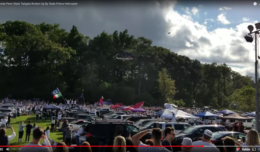 "The helicopter made an initial pass at a higher altitude, but (the) loudspeaker could not be ... heard," Tarkowski said. "The second pass was lower to ensure people on the ground could hear the order to disperse." (Screen grab from youtube video posted by B Mack)