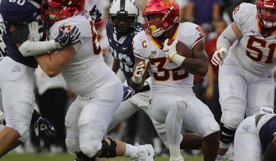Iowa State running back David Montgomery (32) breaks up the middle of the TCU defense in the first half of an NCAA college football game in Fort Worth, Texas, Saturday, Sept. 29, 2018. (Bob Booth/Star-Telegram via AP)