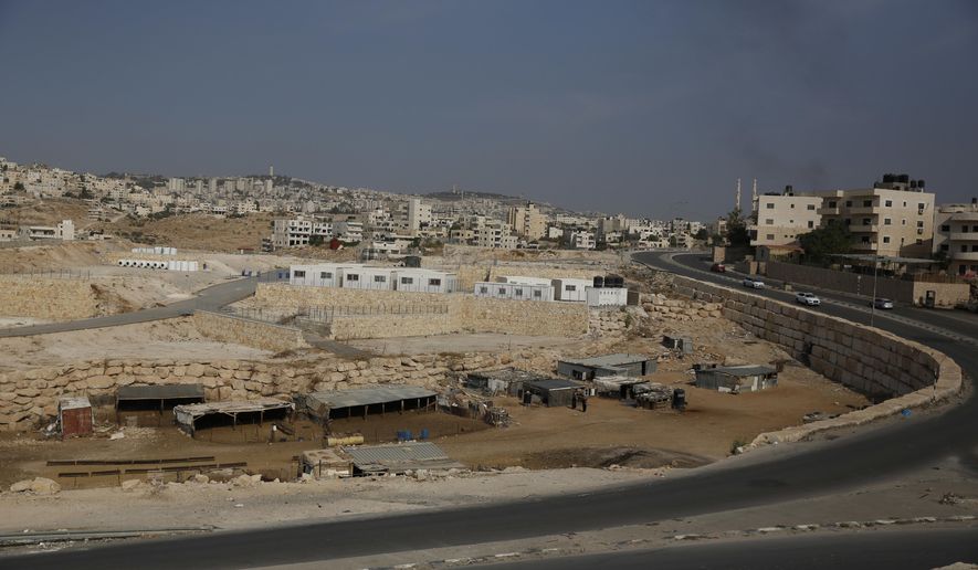 This Sunday, Sept. 30, 2018 photo shows a general view of the location where people from a Bedouin hamlet Khan al-Ahmar are supposed to move to near the West Bank village of Abu Dis. Monday marked the passing of the Israeli-imposed deadline for Khan al-Ahmar's residents to evacuate before forced removal and the demolition of their homes. (AP Photo/Majdi Mohammed)