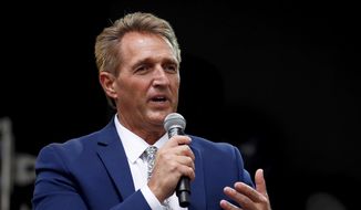 Sen. Jeff Flake, R-Ariz., speaks during an appearance at the Forbes 30 Under 30 Summit, Monday, Oct. 1, 2018, in Boston. (AP Photo/Mary Schwalm) ** FILE **