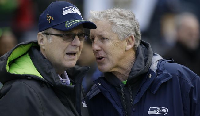 FILE--In this Jan. 18, 2015, file photo, Seattle Seahawks owner Paul Allen, left, talks to head coach Pete Carroll before the NFL football NFC Championship game against the Green Bay Packers in Seattle. Championship game in Seattle. The Billionaire Seahawks owner and Microsoft co-founder says cancer he was treated for in 2009 has returned. (AP Photo/David J. Phillip, file)