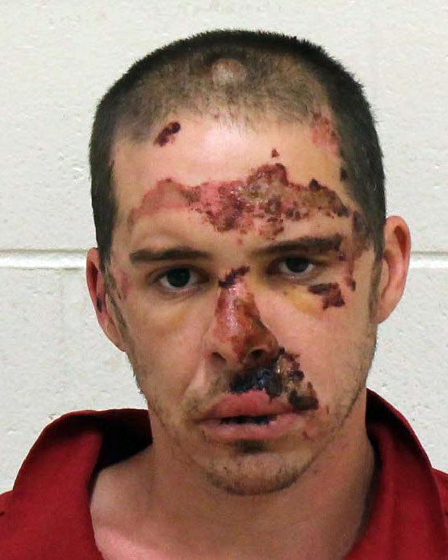 This Sept. 28, 2018 photo released by the Kent County Sheriffs Department shows Adam Nolin. Authorities say Nolin, a homicide suspect, who was injured while exchanging gunfire with officers on a freeway in western Michigan is out of the hospital and behind bars. (Kent County Sheriffs Department via AP)
