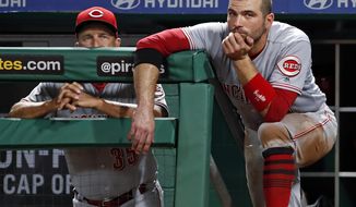 FILE - In this Sept. 5, 2018, file photo, Cincinnati Reds&#39; Joey Votto, right, stands on the dugout steps next to interim manager Jim Riggleman during the fifth inning of a baseball game against the Pittsburgh Pirates, in Pittsburgh. The Reds lost 90 games for the fourth straight season and headed into the offseason unsure who will manage next year. (AP Photo/Gene J. Puskar, File)