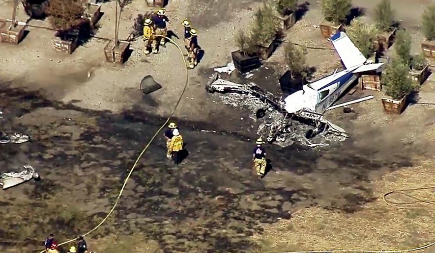 This still photo taken from video provided by KTTV-TV/foxla.com shows the wreckage of a small plane that crashed on the border between a nursery and Brackett Field Airport in La Verne, Calif., killing the pilot, the lone occupant, Monday, Oct. 1, 2018. Federal Aviation Administration spokeswoman Elizabeth Cory said the plane crashed while approaching the airport. Monday's crash was the second in two days at the same airport. On Sunday, Sept. 30, one person was killed and another seriously injured when an aircraft went down inside the nursery next to the same airfield. (KTTV-TV/foxla.com via AP)