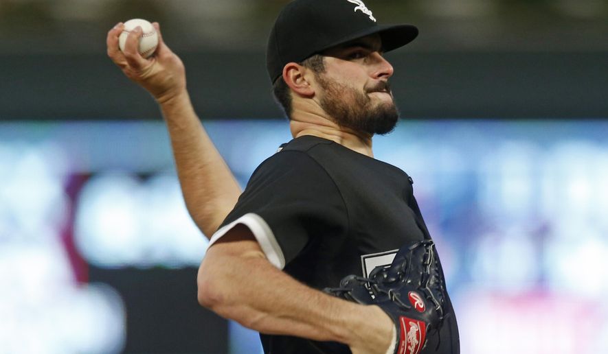 Chicago White Sox pitcher Carlos Rodon throws against the Minnesota Twins in the first inning of a baseball game Saturday, Sept. 29, 2018, in Minneapolis. (AP Photo/Jim Mone)