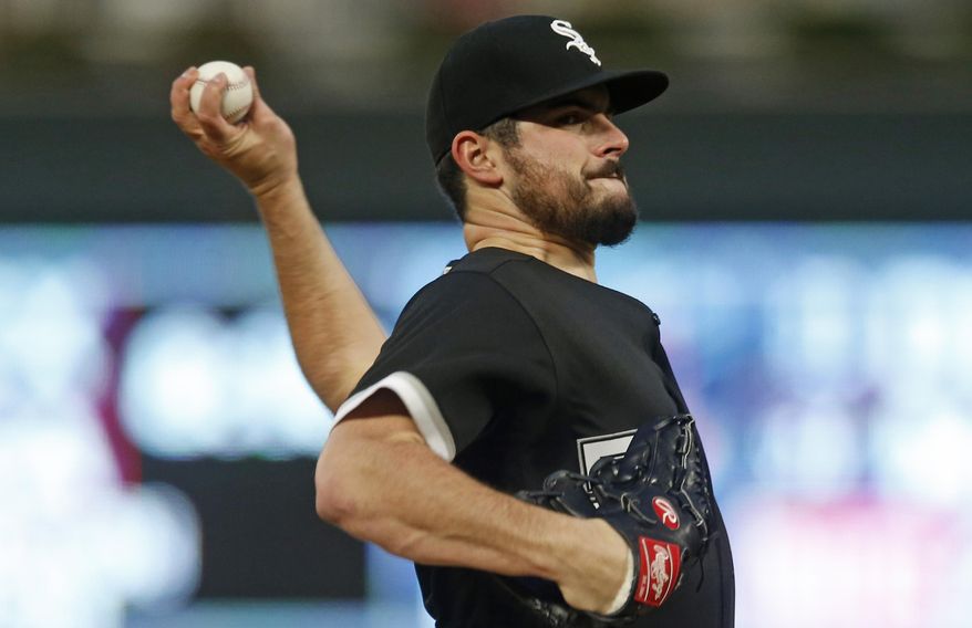 Chicago White Sox pitcher Carlos Rodon throws against the Minnesota Twins in the first inning of a baseball game Saturday, Sept. 29, 2018, in Minneapolis. (AP Photo/Jim Mone)