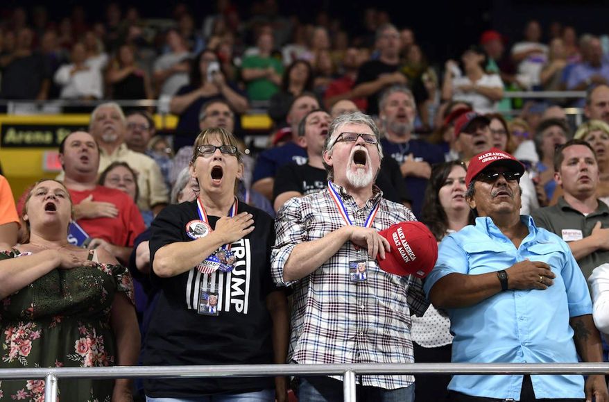 Local fans recite the Pledge of Allegiance at a MAGA rally before President Trump speaks in Johnson City, Tennessee, on Monday. (Associated Press)