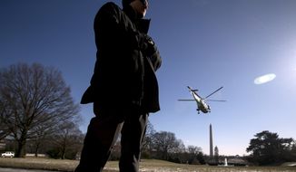 A member of the Secret Service stands guard as Marine One with President Donald Trump aboard departs the South Lawn of the White House in Washington, Friday, Jan. 5, 2018, to travel to Camp David in Maryland. (AP Photo/Andrew Harnik)