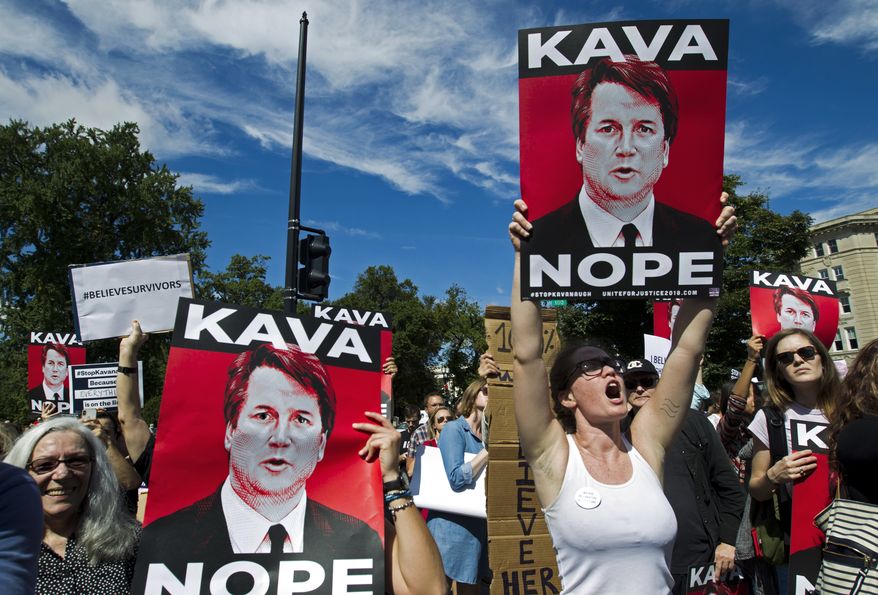 Protesters rally against Supreme Court nominee Brett Kavanaugh as the Senate Judiciary Committee debates his confirmation, Friday, Sept. 28, 2018, at the Supreme Court in Washington. (AP Photo/Jose Luis Magana)