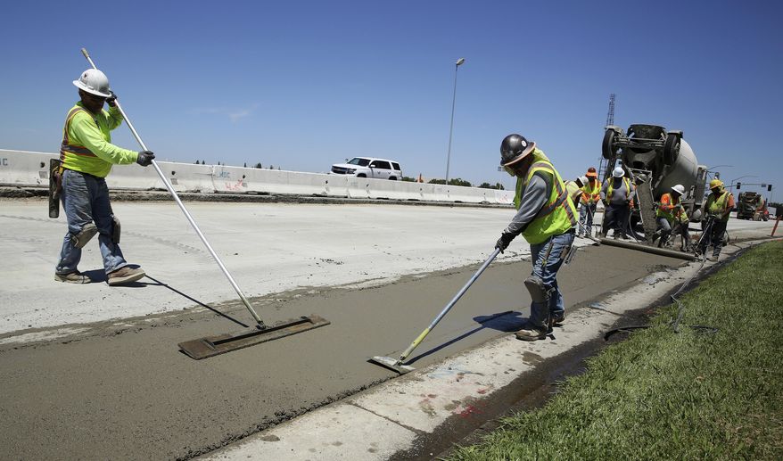 FILE In this July 11, 2018 file photo, workers repave a street in Roseville, Calif., partially funded by a gas tax hike passed by the Legislature in 2017. Leaders of the Proposition 6 campaign to repeal California&#39;s recent gas tax increase are asking the federal government to investigate their claims that public resources have been used against them. A spokeswoman for the anti-Proposition 6 campaign countered the allegations, saying the campaign follows all laws. (AP Photo/Rich Pedroncelli, File)
