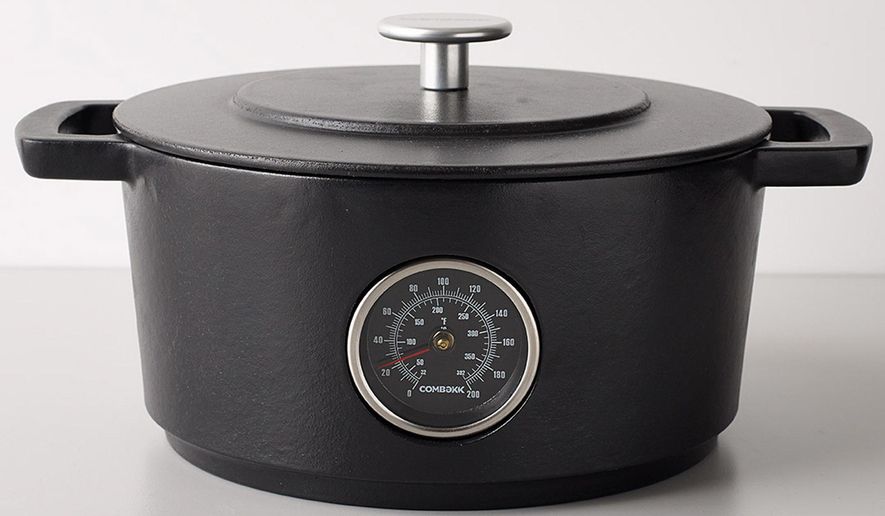 This photo provided by the MoMA Design Store shows the Railway Dutch Oven. Available at the Museum of Modern Art's store, and made in Holland of recycled iron tracks, the Railway Dutch Oven has a handy thermometer built in to help monitor the cooking progress. (MoMA Design Store via AP)