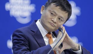 FILE - In this Wednesday, Jan. 24, 2018 file photo, Alibaba founder Jack Ma listens during a session of the annual meeting of the World Economic Forum in Davos, Switzerland. Jack Ma defended trade at a World Trade Organization seminar Tuesday, Oct. 2, 2018 in Switzerland. (AP Photo/Markus Schreiber)