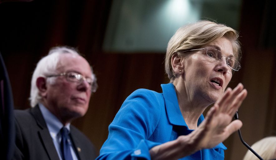 Sen. Elizabeth Warren, D-Mass., right, accompanied by Sen. Bernie Sanders, I-Vt., left, speaks during a news conference on Capitol Hill in Washington, Wednesday, Sept. 13, 2017, to unveil their &quot;Medicare for All&quot; legislation to reform health care. (AP Photo/Andrew Harnik) ** FILE **