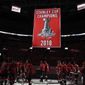 Washington Capitals skate on the ice as the team&#39;s Stanley Cup championship banner is raised before the team&#39;s NHL hockey game against the Boston Bruins, Wednesday, Oct. 3, 2018, in Washington. (AP Photo/Nick Wass)