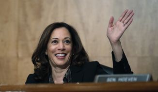 Sen. Kamala Harris, D-Calif., waves to another member of the committee during a hearing of the the Senate Committee on Homeland Security and Governmental Affairs for Steven D. Dillingham to be Director of the Census, on Capitol Hill, Wednesday, Oct. 3, 2018 in Washington. (AP Photo/Alex Brandon)