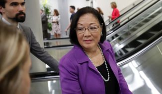 Sen. Mazie Hirono, D-Hawaii, listens to a reporter&#39;s question on Capitol Hill, Wednesday, Oct. 3, 2018, in Washington. (AP Photo/Alex Brandon) ** FILE **