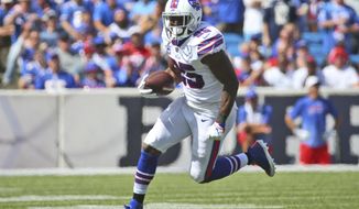 FILE - In this Sept. 16, 2018, file photo, Buffalo Bills&#39; LeSean McCoy runs during the first half of an NFL football game against the Los Angeles Chargers, in Orchard Park, N.Y. McCoy vows he&#39;s playing at Green Bay on Sunday, Sept. 30, after missing one game with a rib cartilage injury. McCoy made the announcement after saying he was able to run at full speed during practice Wednesday, Sept. 26, 2018. (AP Photo/Rich Barnes, File)