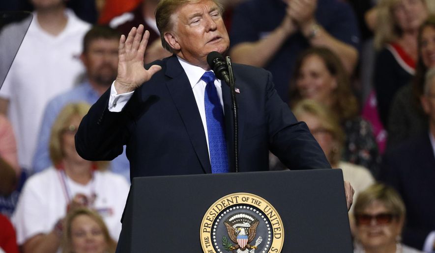President Donald Trump gestures as he speaks about some Democrats in Congress at a rally Tuesday, Oct. 2, 2018, in Southaven, Miss. (AP Photo/Rogelio V. Solis)