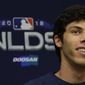 Milwaukee Brewers&#39; Christian Yelich answers questions during a news conference for the National League Divisional Series baseball game Wednesday, Oct. 3, 2018, in Milwaukee. (AP Photo/Morry Gash)