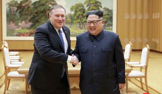 FILE - In this May 9, 2018, file photo provided by the North Korean government, U.S. Secretary of State Mike Pompeo, left, shakes hands with North Korean leader Kim Jong Un during a meeting at Workers&#39; Party of Korea headquarters in Pyongyang, North Korea. North Korea warned Washington through its state media Tuesday, Oct. 2, that a declaration ending the Korean War shouldn&#39;t be seen as a bargaining chip in denuclearization talks — but suggested lifting sanctions might be. Independent journalists were not given access to cover the event depicted in this image distributed by the North Korean government. The content of this image is as provided and cannot be independently verified. Korean language watermark on image as provided by source reads: &amp;quot;KCNA&amp;quot; which is the abbreviation for Korean Central News Agency. (Korean Central News Agency/Korea News Service via AP, File)