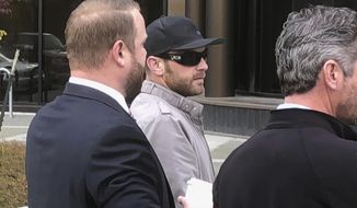 Track Palin, center, Todd Palin, right, and attorney Patrick Bergt stand outside court in Anchorage, Alaska, on Wednesday, Oct. 3, 2018. The oldest son of former Alaska Gov. Sarah Palin, Track Palin, will spend a year in custody after a judge decided new assault allegations disqualified him from a therapeutic program for veterans linked to another assault case. A judge told Track Palin on Wednesday that he was dropped from the program offering veterans mental health treatment instead of a traditional sentence. (AP Photo/Rachel D&#39;Oro)