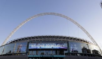 A view of the exterior of Wembley Stadium in London, Wednesday, Oct. 3, 2018. Britain is looking to host up to 60 major sporting events over the next 15 years, including soccer’s World Cup, to assert global influence and secure trade deals after Brexit. Building on the successful of the 2012 Olympics in London and the English Premier League, hosting major sporting events is now embraced as a key instrument of soft power by British Prime Minister Thresa May’s government. The UK Sport list of sporting events being targeted was revealed hours after May’s speech to her Conservative Party conference, with the centerpiece the 2030 World Cup.  (AP Photo/Kirsty Wigglesworth)