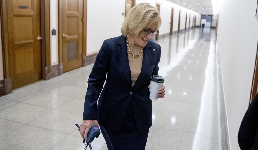 Sen. Maggie Hassan, N.H., arrives for a hearing on Capitol Hill in Washington, Tuesday, Sept. 25, 2018. (AP Photo/Andrew Harnik)