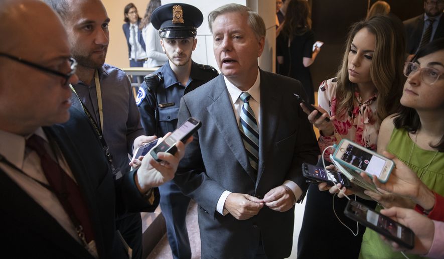 Sen. Lindsey Graham, R-S.C., a member of the Senate Judiciary Committee, responds to reporters outside a secure underground room in the Capitol where senators are being briefed on a new FBI background file on sexual allegations that have been made against Supreme Court nominee Brett Kavanaugh, in Washington, Wednesday, Oct. 3, 2018. (AP Photo/J. Scott Applewhite)