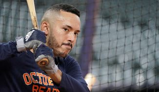Houston Astros&#39; Carlos Correa waits to bat during a baseball workout Thursday, Oct. 4, 2018, in Houston. The Astros play the Cleveland Indians in Game 1 of the American League Division Series Friday. (AP Photo/David J. Phillip)