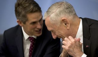 U.S. Secretary for Defence Jim Mattis, right, talks to Britain&#x27;s Defence Minister Gavin Williamson before a signing ceremony following a meeting of NATO defence ministers at NATO headquarters in Brussels, Wednesday, Oct. 3, 2018. (AP Photo/Francisco Seco, Pool)