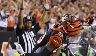 FILE - In this Sept. 13, 2018, file photo, Cincinnati Bengals wide receiver Tyler Boyd (83) celebrates after scoring a touchdown in the first half of an NFL football game against the Baltimore Ravens,  in Cincinnati. Boyd was a disappointment in his first two seasons, starting only three games and scoring only three touchdowns. He’s emerged as the Bengals’ leading receiver during their 3-1 start. (AP Photo/Frank Victores, File)