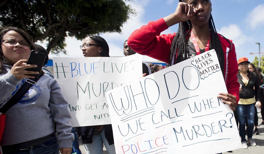 In this July 9, 2016, file photo, Emani Williams joins protesters rallying against the fatal shootings by police of black men in San Francisco. Five black women and a black man are suing the San Francisco Police Department alleging racial bias, claiming they were targeted for arrest by a department plagued with a culture of racism. (AP Photo/Noah Berger, file)
