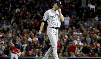 New York Yankees starting pitcher J.A. Happ leaves during the third inning against the Boston Red Sox in Game 1 of a baseball American League Division Series on Friday, Oct. 5, 2018, in Boston. (AP Photo/Elise Amendola)