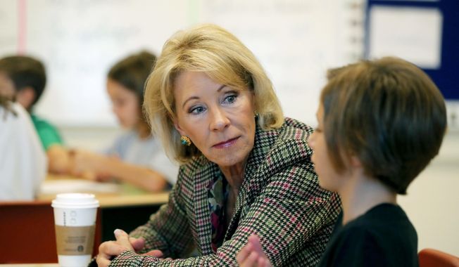 Education Secretary Betsy DeVos visits a classroom at the Edward Hynes Charter School in New Orleans, Friday, Oct. 5, 2018. (AP Photo/Gerald Herbert)