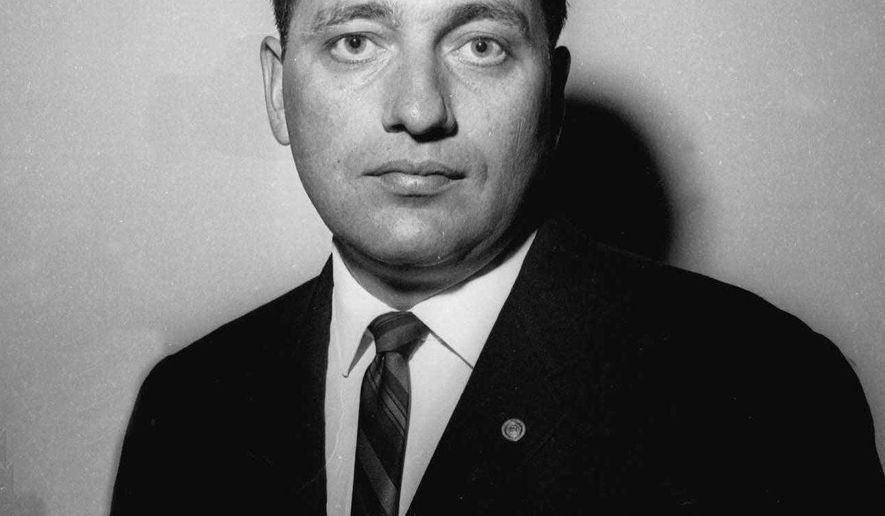 FILE - In this Dec. 3, 1963 file photo, U.S. Secret Service Special Agent Clinton J. Hill poses in Washington. Hill who famously used his body to shield first lady Jacqueline Kennedy the day President John F. Kennedy was assassinated will receive the highest honor bestowed by his home state of North Dakota. The former agent will receive the Theodore Roosevelt Rough Rider Award during a future ceremony, Gov. Doug Burgum announced Friday, Oct. 5, 2018. (AP Photo/Robert H. Shutz File)