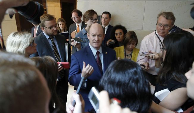 Sen. Chris Coons, D-Del., talks with the media after viewing the FBI report on sexual misconduct allegations against Supreme Court nominee Brett Kavanaugh, on Capitol Hill, Thursday, Oct. 4, 2018 in Washington. (AP Photo/Alex Brandon)