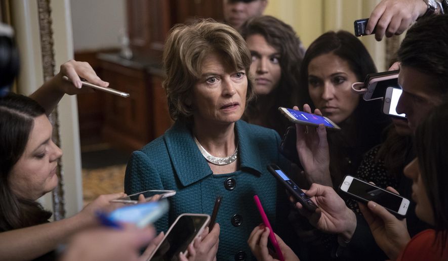 Republican Sen. Lisa Murkowski of Alaska, speaks with reporters just after a deeply divided Senate pushed Brett Kavanaugh&#39;s Supreme Court nomination past a key procedural hurdle, setting up a likely final showdown vote for Saturday, at the Capitol in Washington, Friday, Oct. 5, 2018. (AP Photo/J. Scott Applewhite)