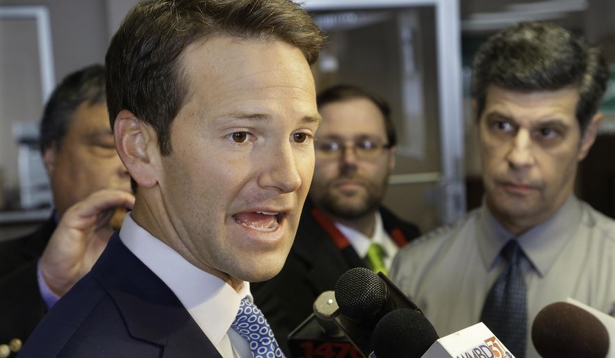 FILE - In this Feb. 6, 2015 file photo, then-Illinois Rep. Aaron Schock speaks to reporters in Peoria Ill. Schock’s public corruption trial is now scheduled for June 2019 in federal court in Chicago. Schock was once a rising star in Congress and a formidable GOP fundraiser. He is accused of using campaign money and his congressional allotment for personal expenses and extravagant redecorating of his Capitol Hill office in the style of the TV series “Downton Abbey.” (AP Photo/Seth Perlman, File)