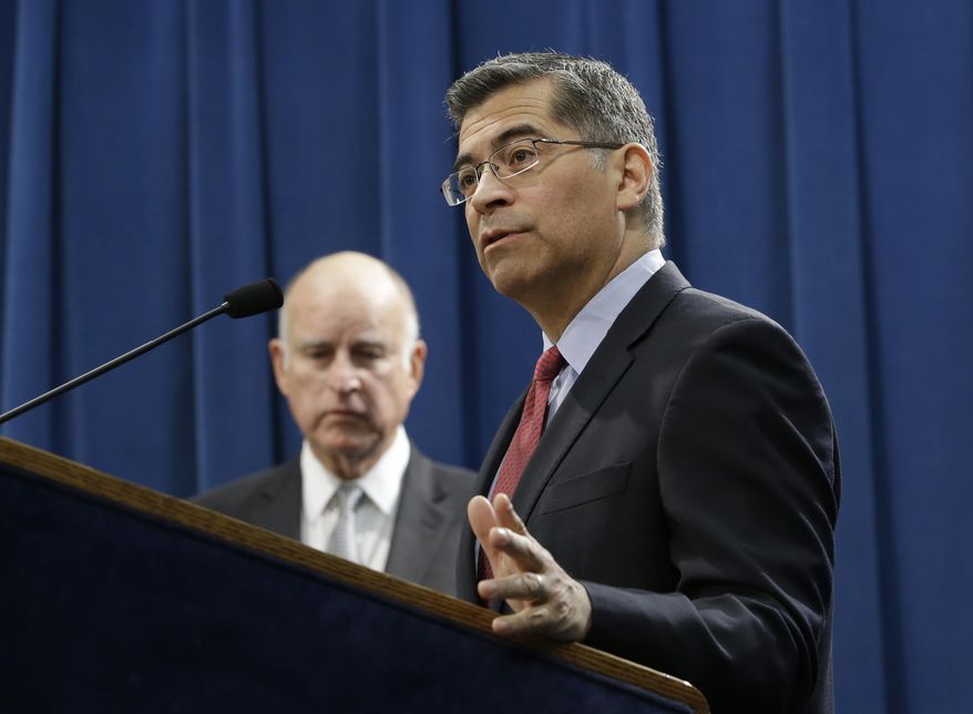 In this March 7, 2018 file photo California Attorney General Xavier Becerra, right, accompanied by California Gov. Jerry Brown, left, discusses remarks made by U.S. Attorney General Jeff Sessions, in Sacramento, Calif. Becerra fights the Trump administration at seemingly every turn and wants voters to keep him in the job to continue the battle. (AP Photo/Rich Pedroncelli,File)