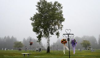 The early-morning fog shrouds the cemetery in Libby, Montana, on a mid-September day. At least 400 deaths have been documented to be related to asbestos exposure in the town, but health officials suspect the number to be much higher. For years, the hospital was run by W.R. Grace, the same company that owned the mine, and &amp;quot;asbestos&amp;quot; never appeared on a death certificate in Libby. (Kurt Wilson/The Missoulian via AP)